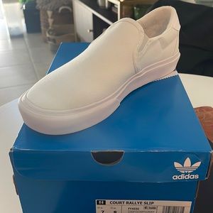 Brand new pair of Adidas slip on sneakers!